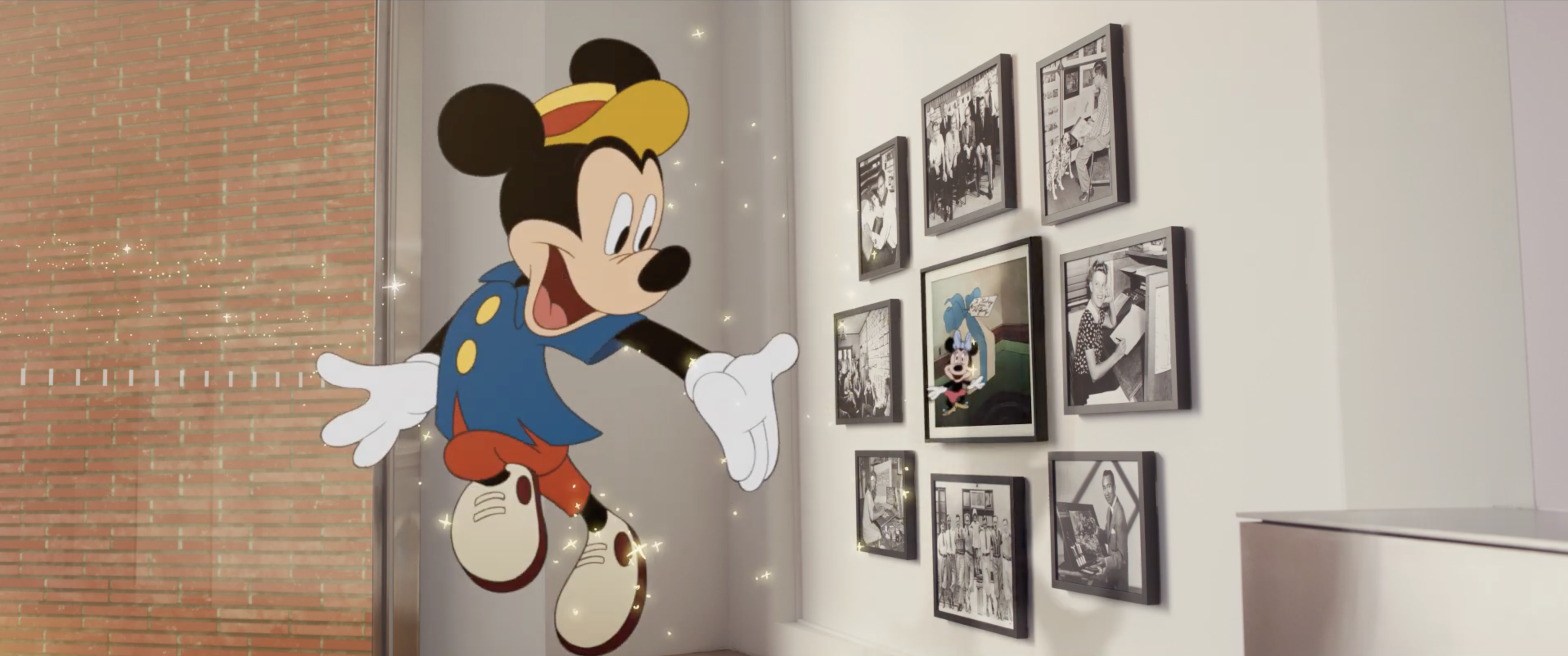 Mickey Mouse leaping out of a framed portrait on the wall of the Disney Animation Building in the upcoming short film "Once Upon A Studio"