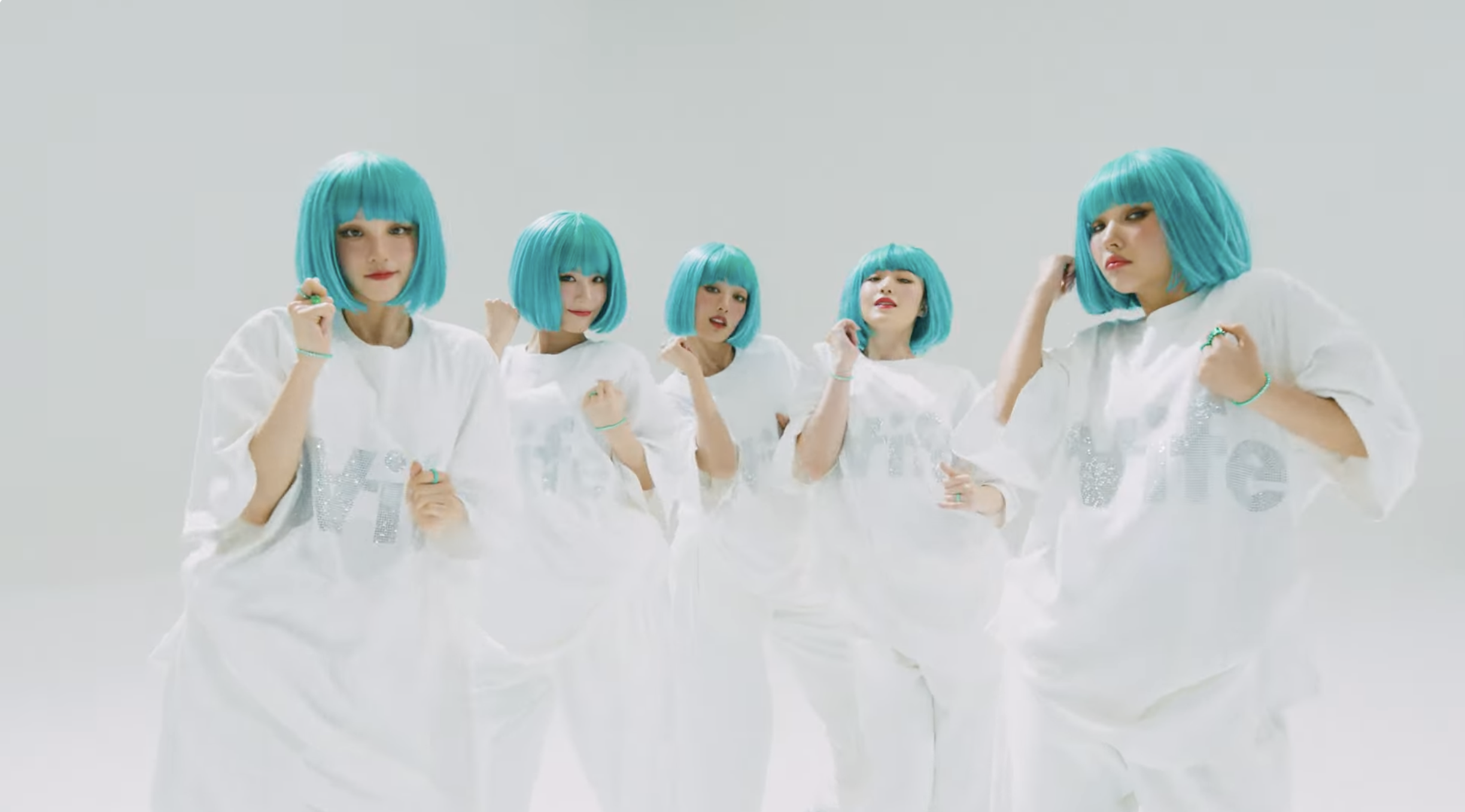 (G)I-DLE music video "Wife" features members in all white outfit with bright turquoise bob wigs.